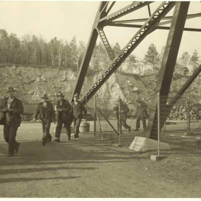 Shift changes at the Soudan Mine.  Miners head for the “dry” as their work day ends. The Soudan Mine, the first iron mine in Minnesota, was closed in December 1962. It opened in 1965 as a State Park offering spectacular underground tours of the mine.  Its caverns over the years also housed scientific experimental studies, as well as studies on the bat species.